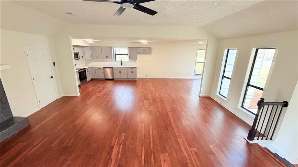 5257 Post Ridge Court Stone Mountain, GA 30088 - Photo 7 of 42 a view of empty room with wooden floor and window