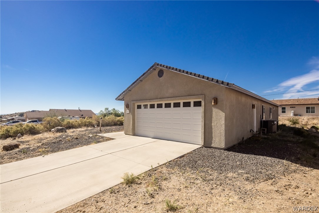 4169 Bluff Road Golden Valley, AZ 86413 - Photo 3 of 38 a front view of a house with a yard