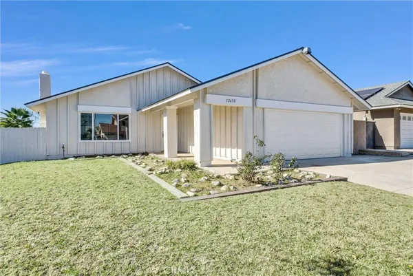 a house with trees in the background