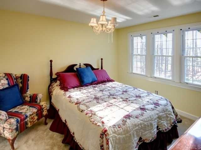 13709 Possum Track Road Raleigh, NC 27614 - Photo 8 of 12 Spacious secondary bedroom overlooking large private homesite! Brand new carpet on second floor!!! Bedroom