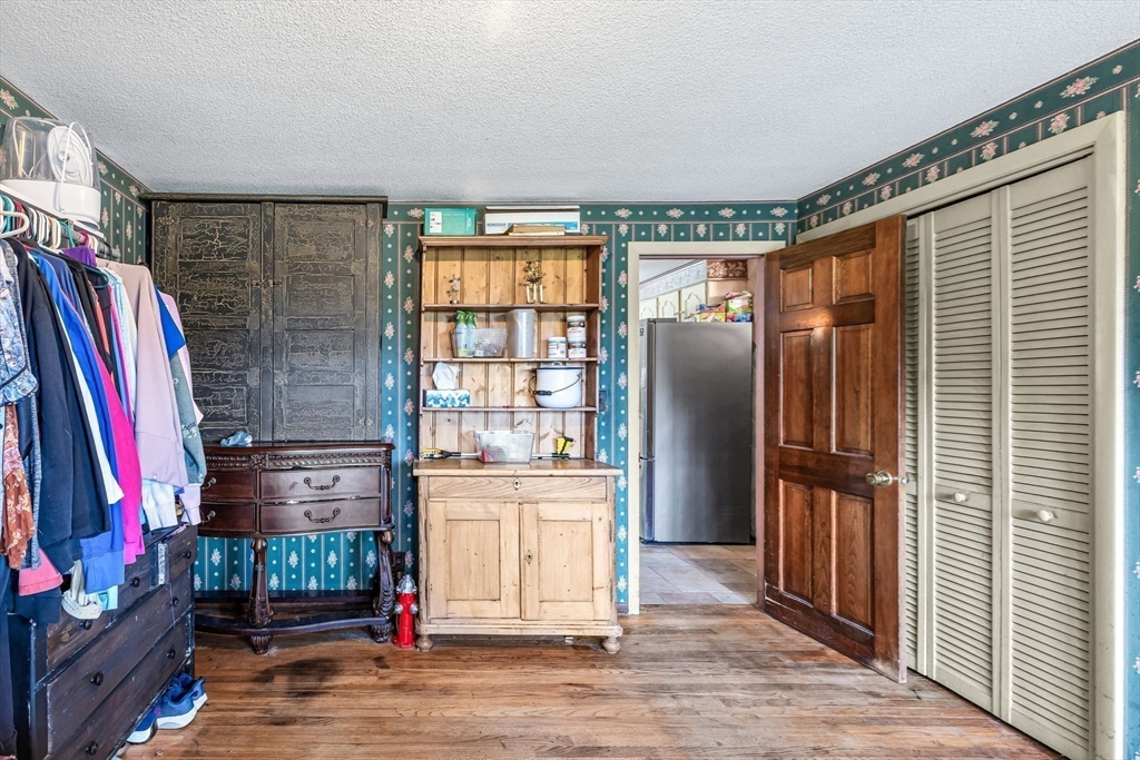 163 South Monson Road Hampden, MA 01036 - Photo 9 of 34 a view of walk in closet with clothes and shoes