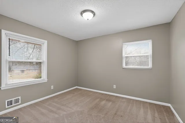 an empty room with windows