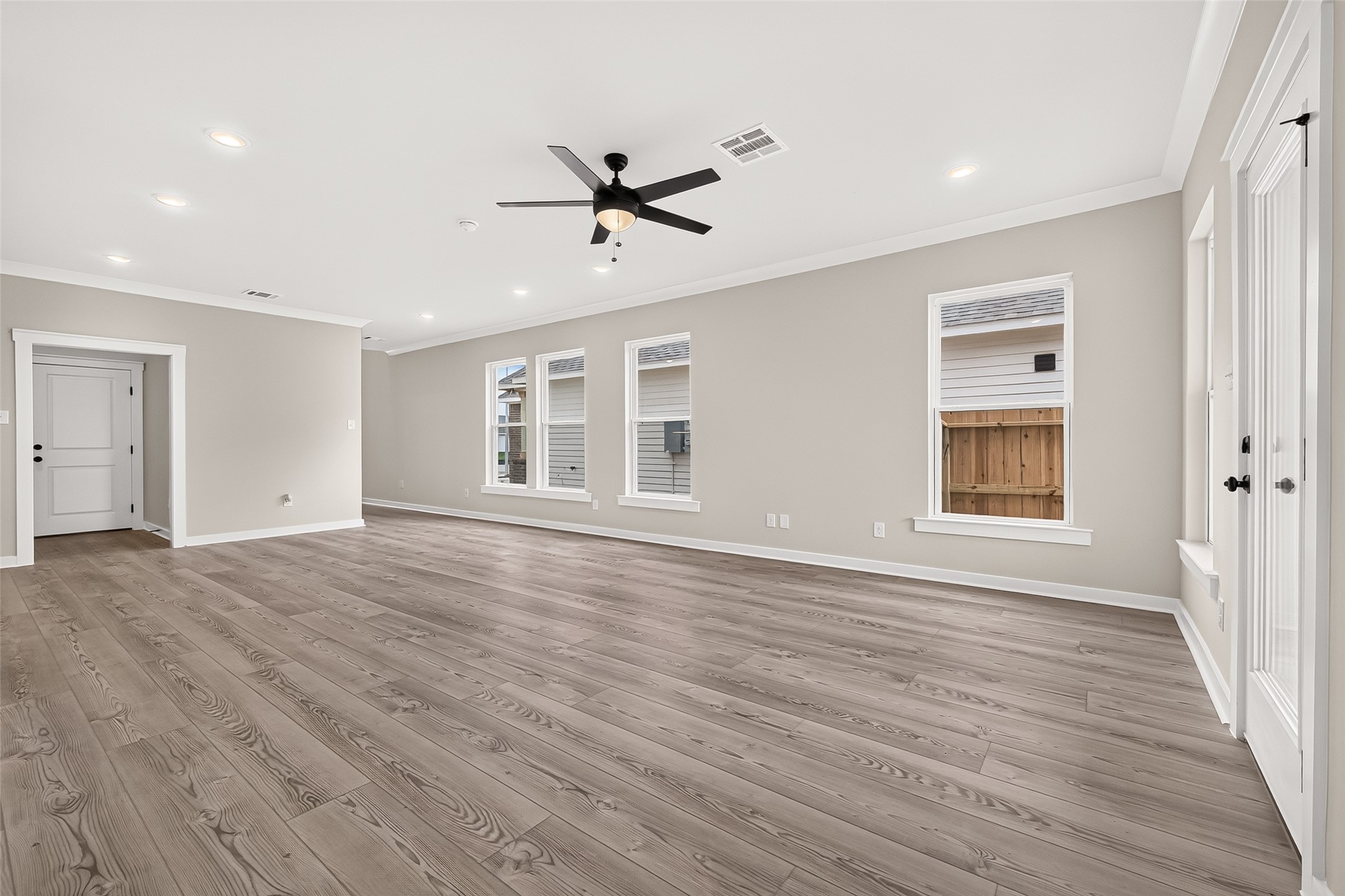 21122 Autumn Heights Rosharon, TX 77583 - Photo 11 of 42 a view of empty room with wooden floor and window