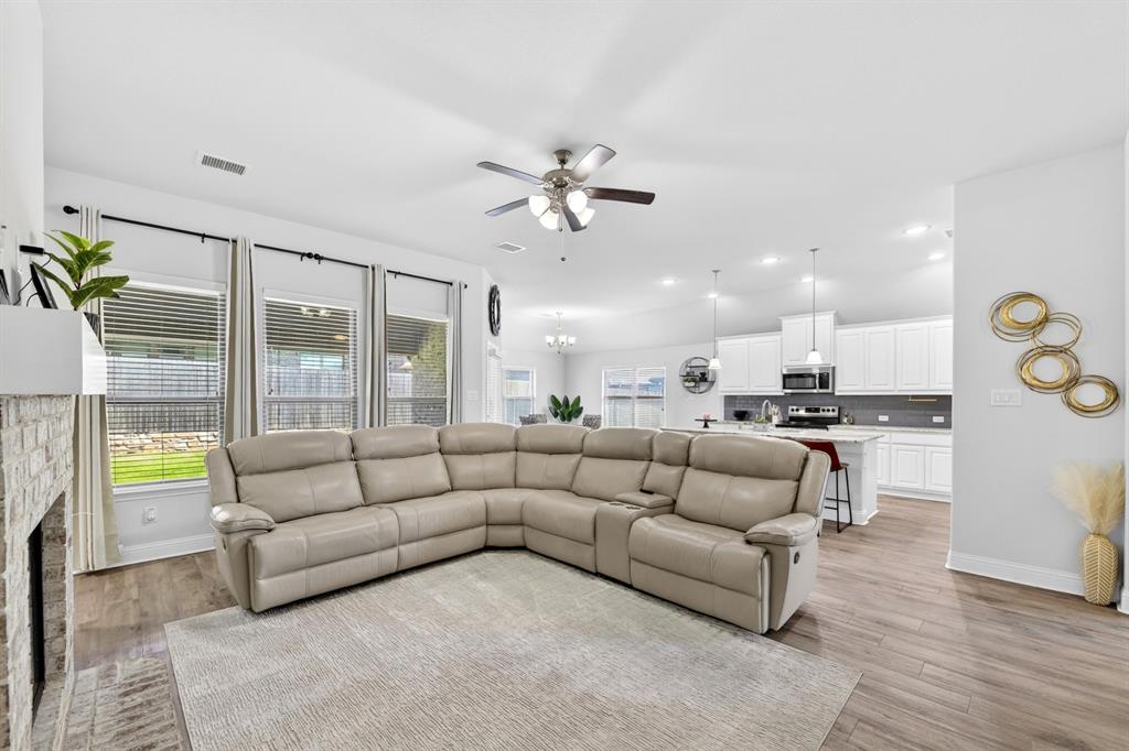 136 Gleeson Drive Red Oak, TX 75154 - Photo 20 of 40 a living room with furniture and a large window with kitchen view