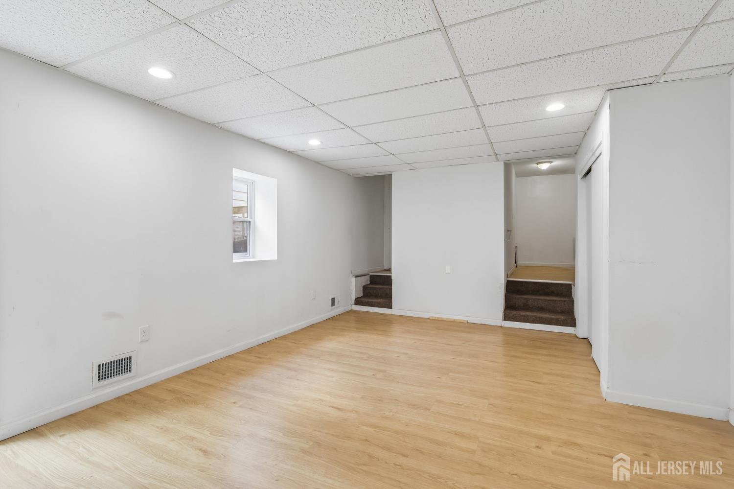 36 Henry Street Edison, NJ 08820 - Photo 34 of 42 a view of an empty room with a window