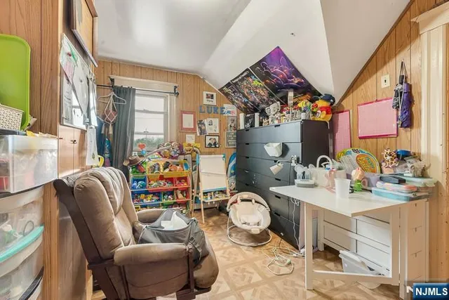 a view of living room filled with furniture and toys