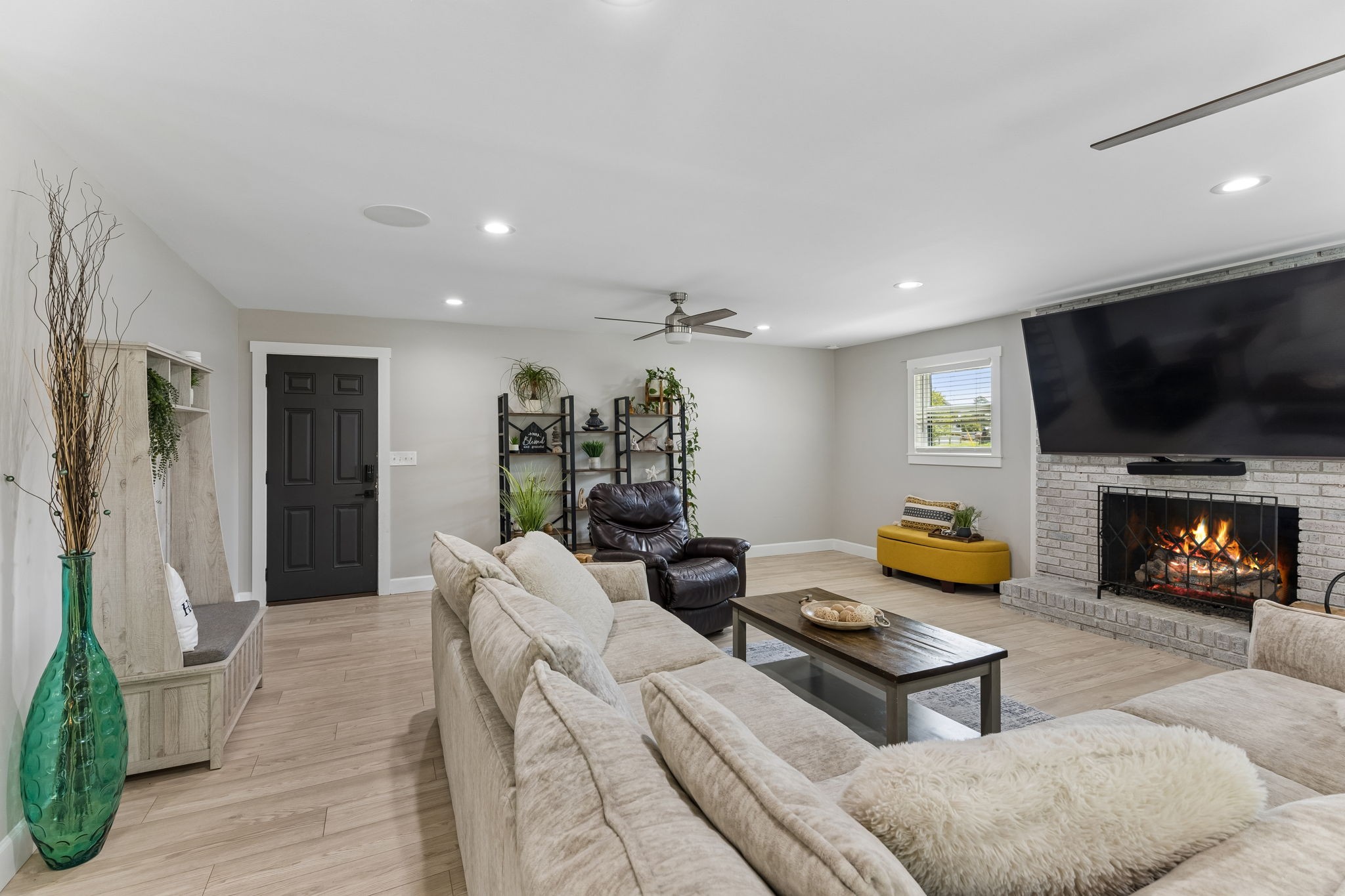 109 Indian Creek Road Hohenwald, TN 38462 - Photo 14 of 69 a living room with furniture and a flat screen tv
