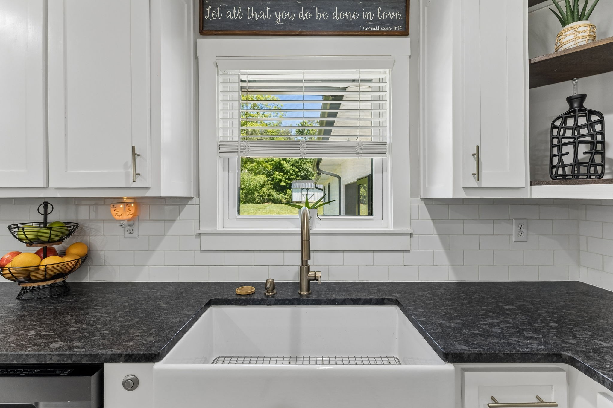 109 Indian Creek Road Hohenwald, TN 38462 - Photo 21 of 69 a kitchen with granite countertop a sink and a window