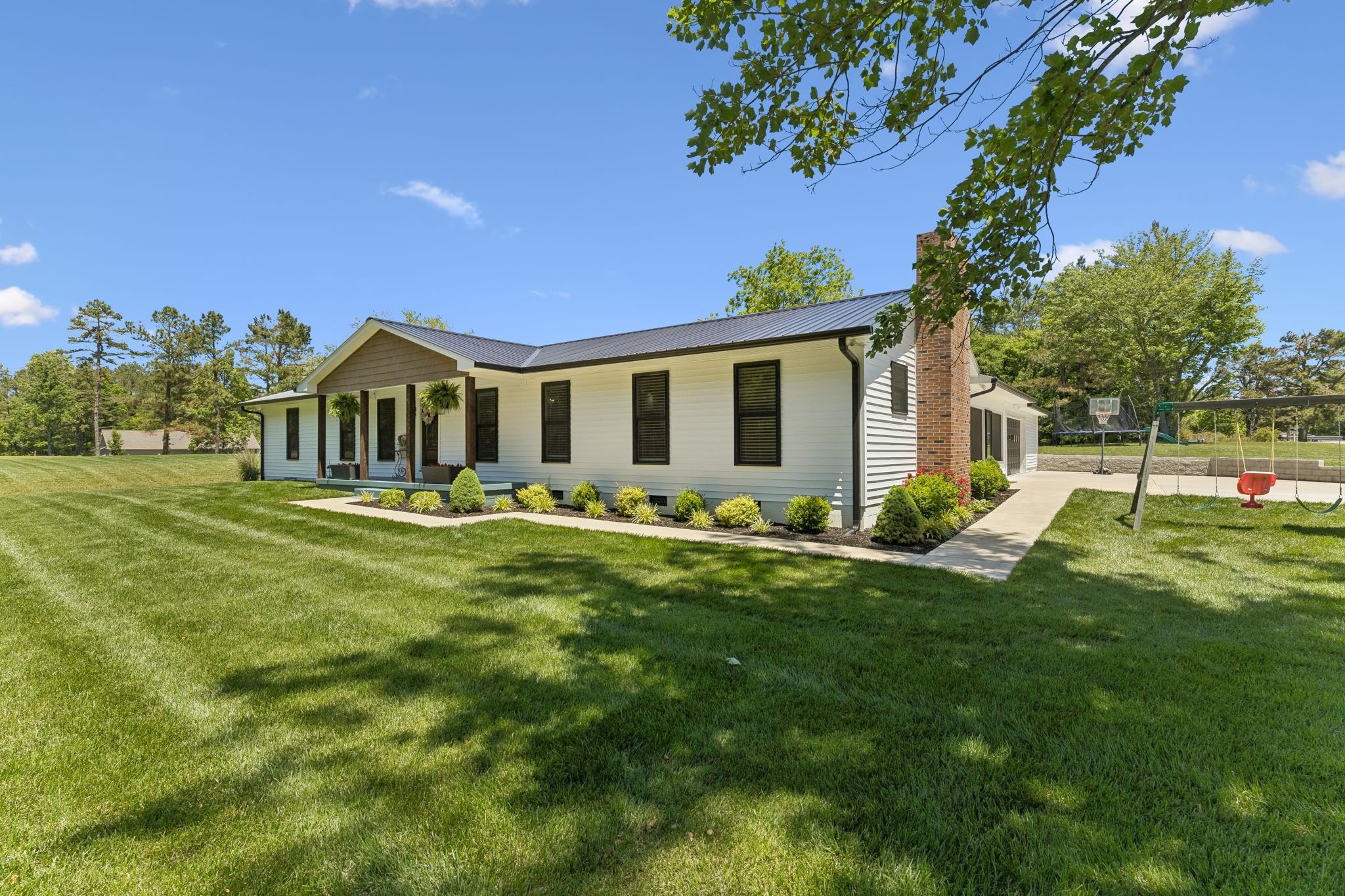 109 Indian Creek Road Hohenwald, TN 38462 - Photo 3 of 69 a front view of house with yard and green space