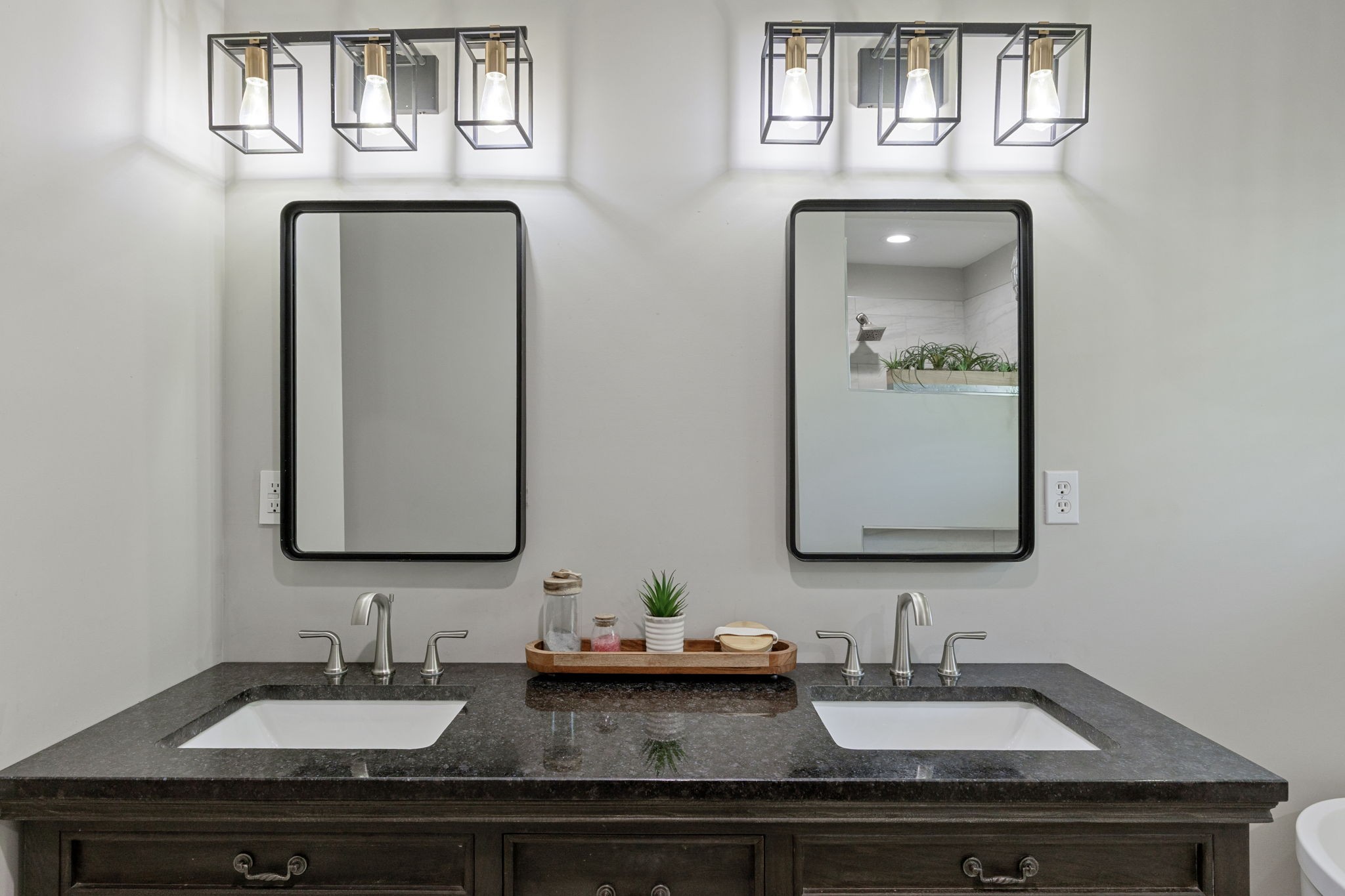 109 Indian Creek Road Hohenwald, TN 38462 - Photo 31 of 69 a bathroom with double vanity sinks and a mirror
