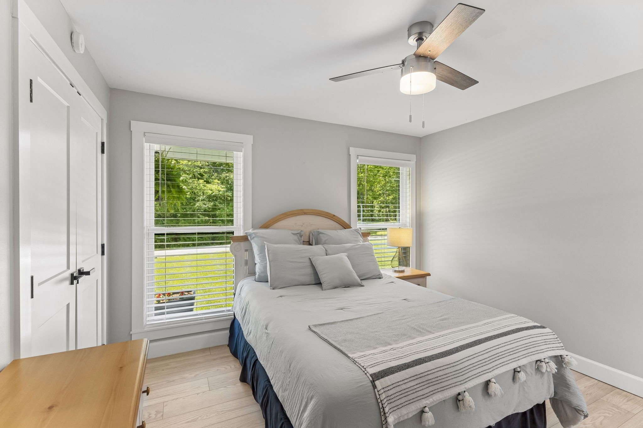 109 Indian Creek Road Hohenwald, TN 38462 - Photo 36 of 69 a bedroom with a bed and a chandelier