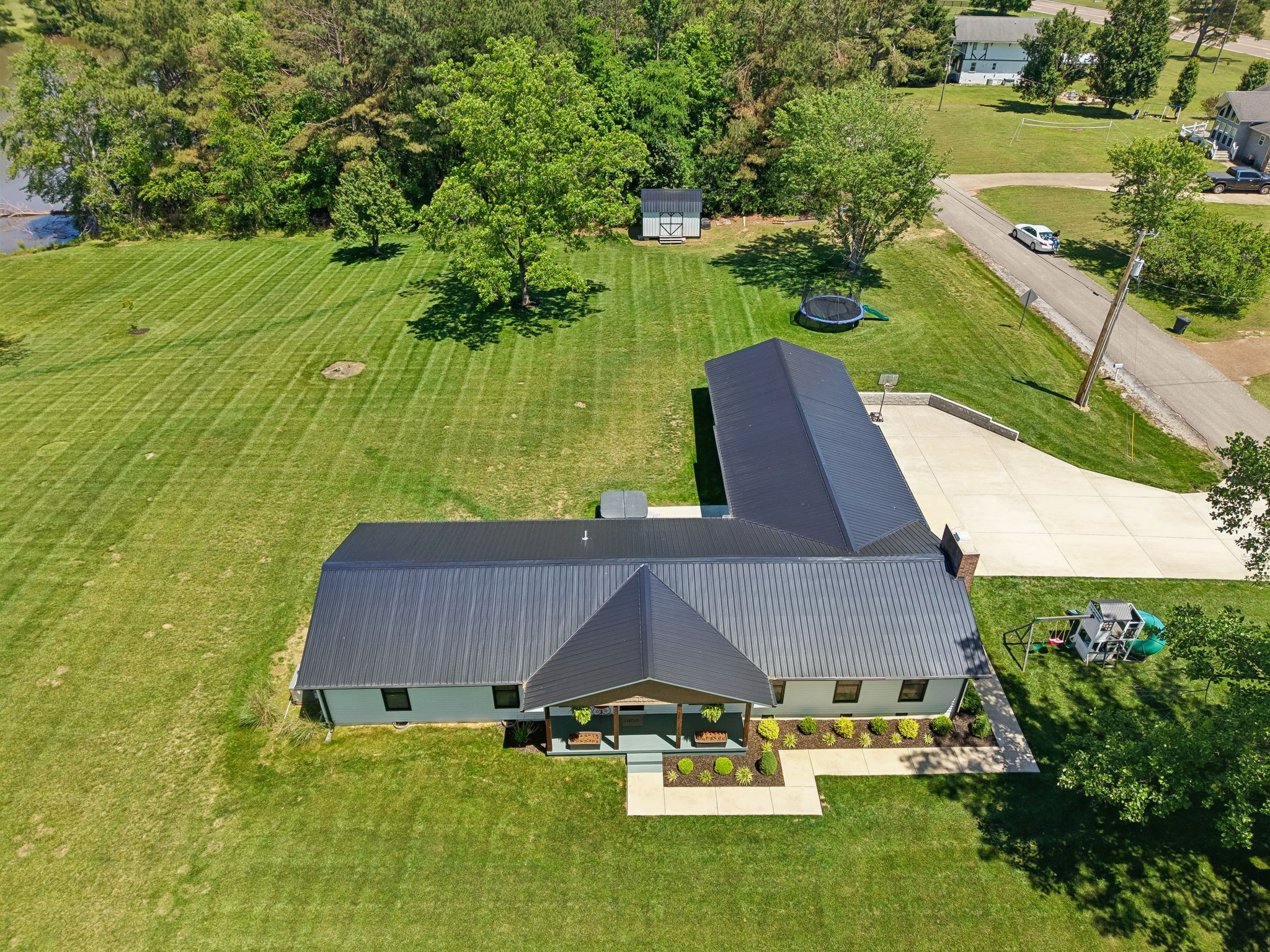 109 Indian Creek Road Hohenwald, TN 38462 - Photo 54 of 69 an aerial view of a house with yard swimming pool and outdoor seating