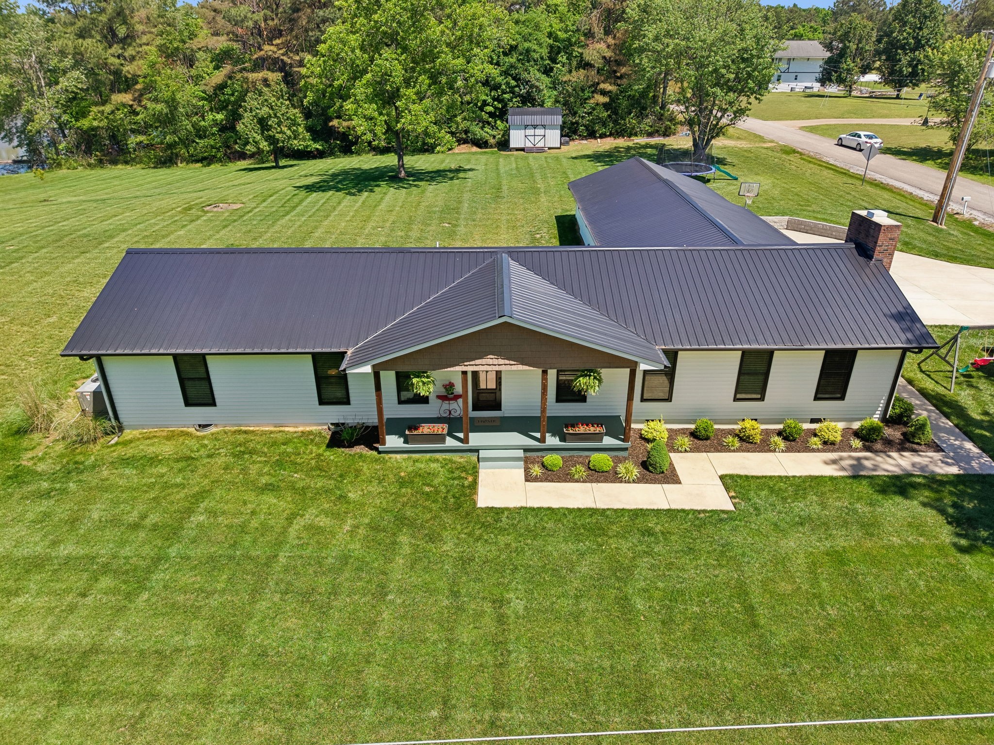 109 Indian Creek Road Hohenwald, TN 38462 - Photo 55 of 69 a view of a house with pool and a yard