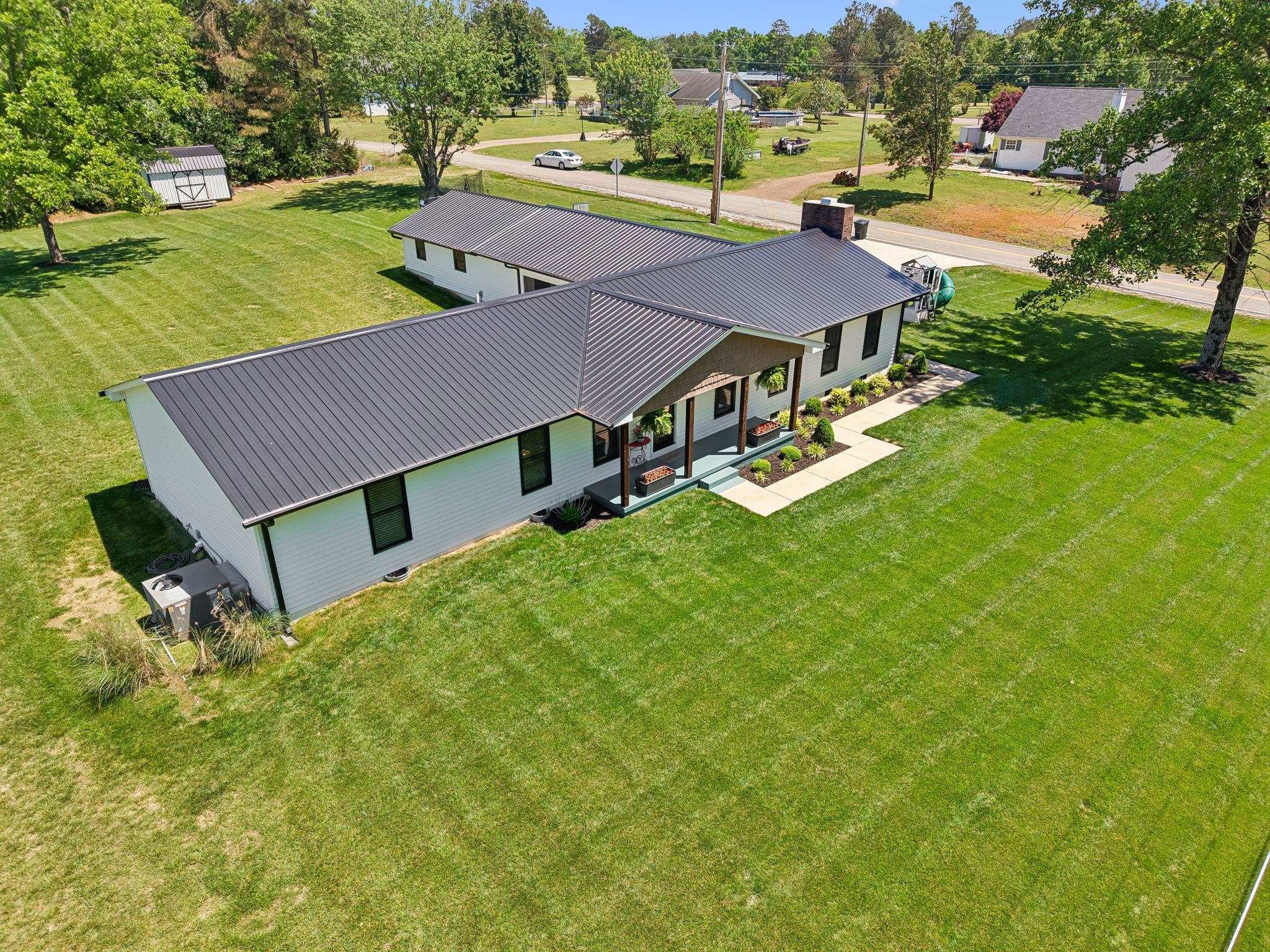 109 Indian Creek Road Hohenwald, TN 38462 - Photo 56 of 69 an aerial view of a house with swimming pool garden and patio