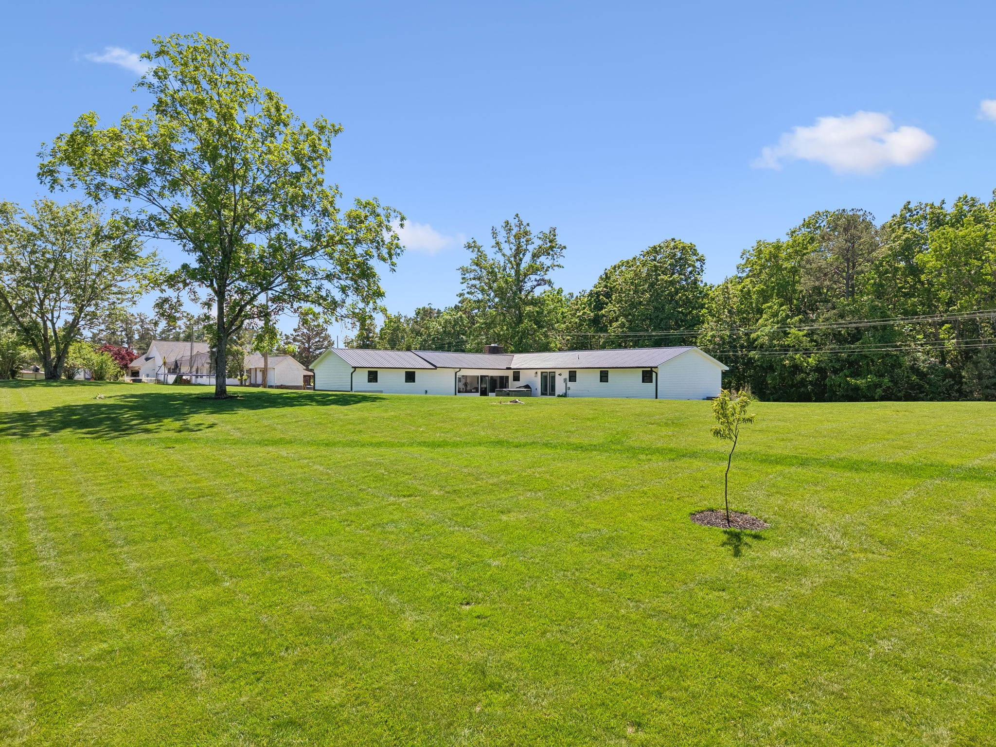 109 Indian Creek Road Hohenwald, TN 38462 - Photo 62 of 69 a house with garden in front of it