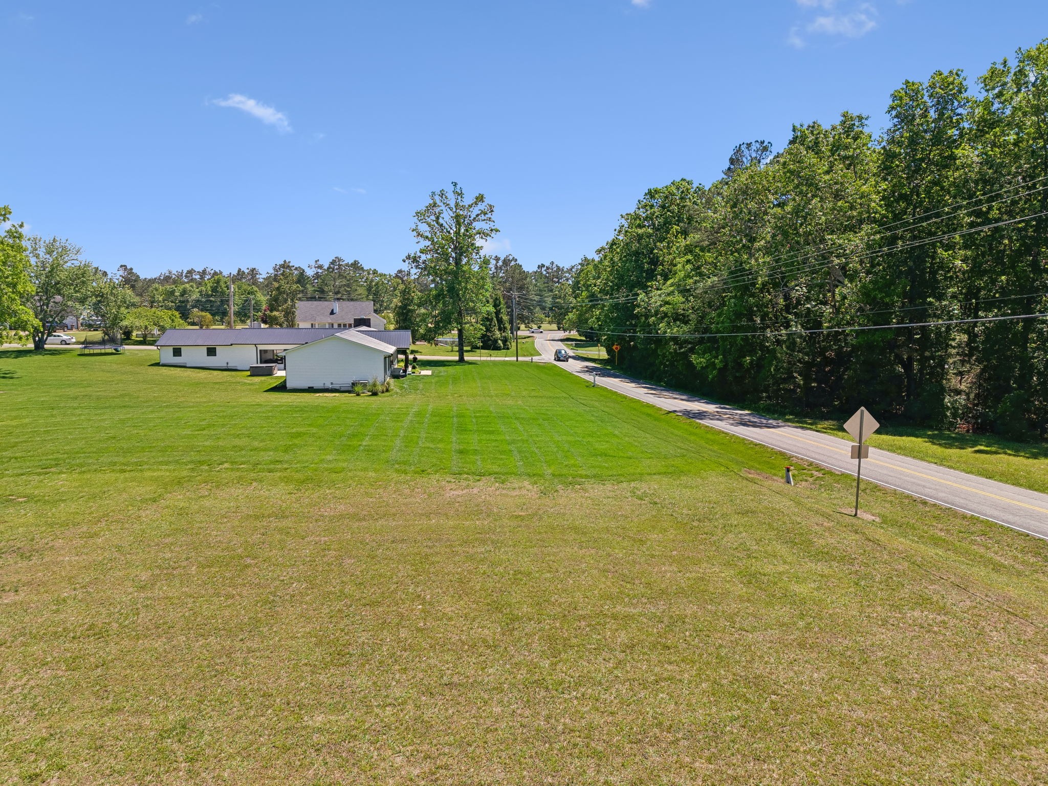 109 Indian Creek Road Hohenwald, TN 38462 - Photo 64 of 69 a swimming pool with an outdoor space and seating area