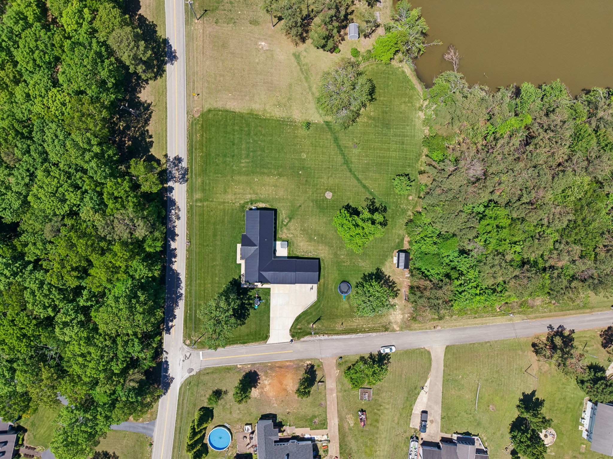 109 Indian Creek Road Hohenwald, TN 38462 - Photo 69 of 69 an aerial view of a house with a yard