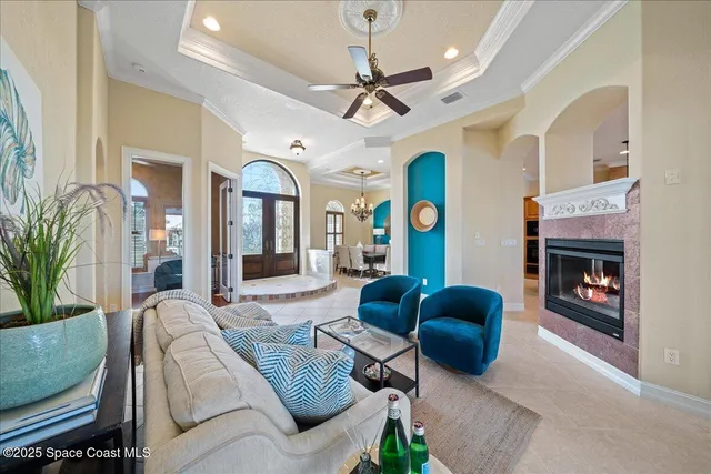 a view of a lake with couches wooden floor and lake view