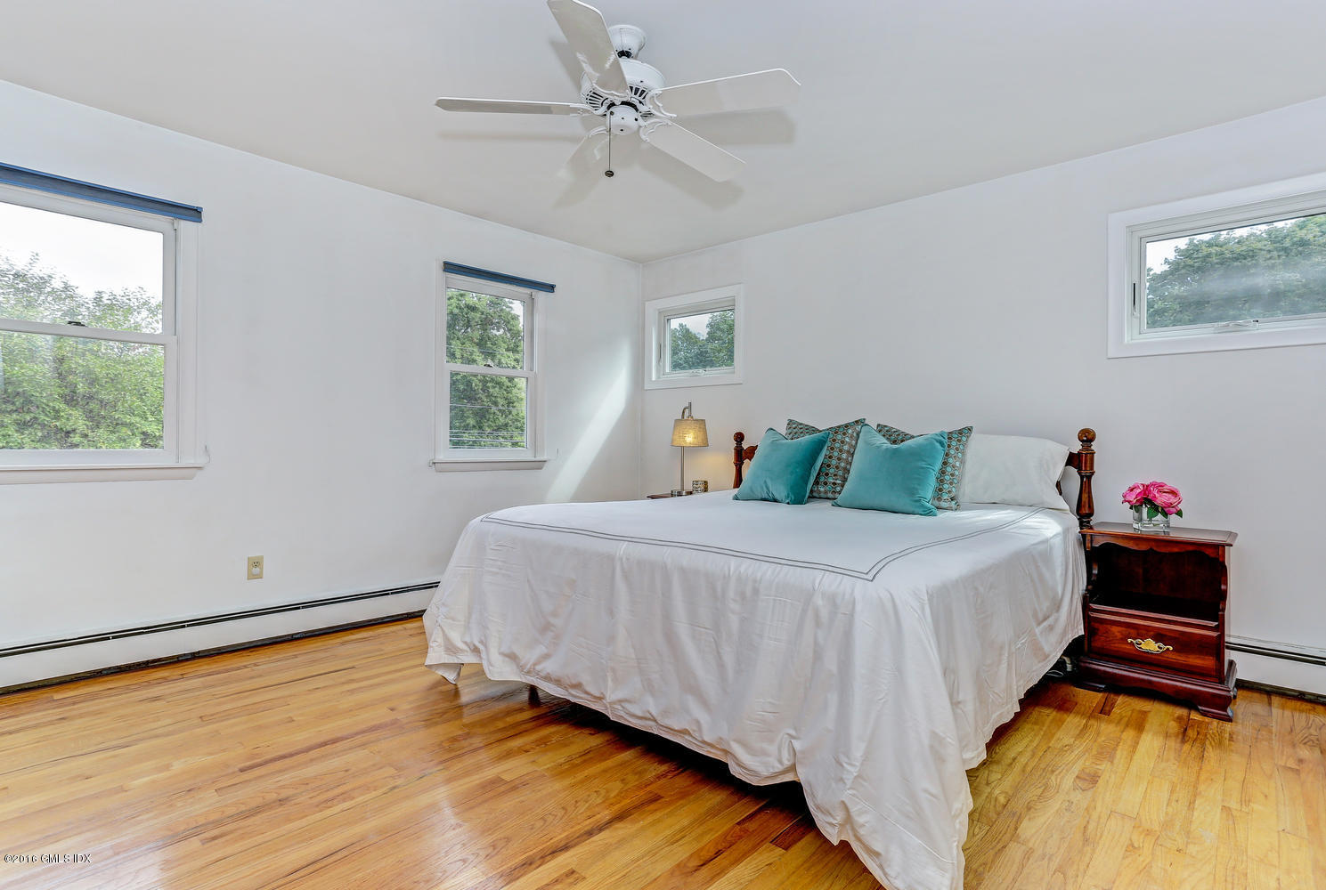 12 Lake Drive, Unit SOUTH Riverside, CT 06878 - Photo 11 of 21 a bedroom with a bed and a window