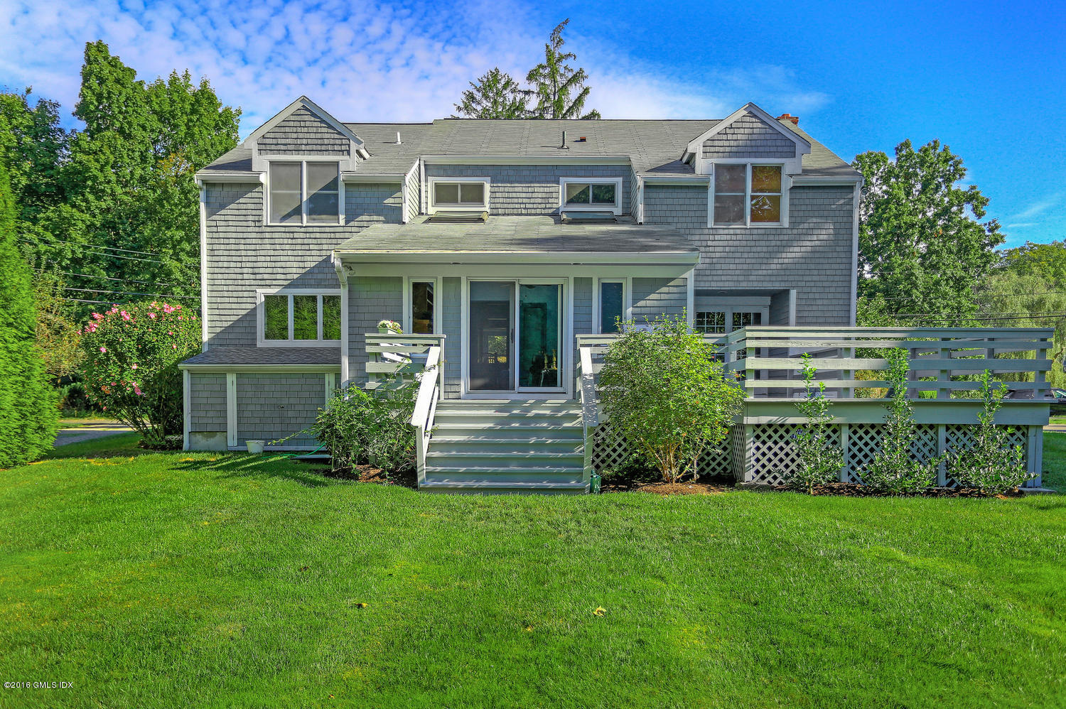 12 Lake Drive, Unit SOUTH Riverside, CT 06878 - Photo 13 of 21 a front view of a house with a garden