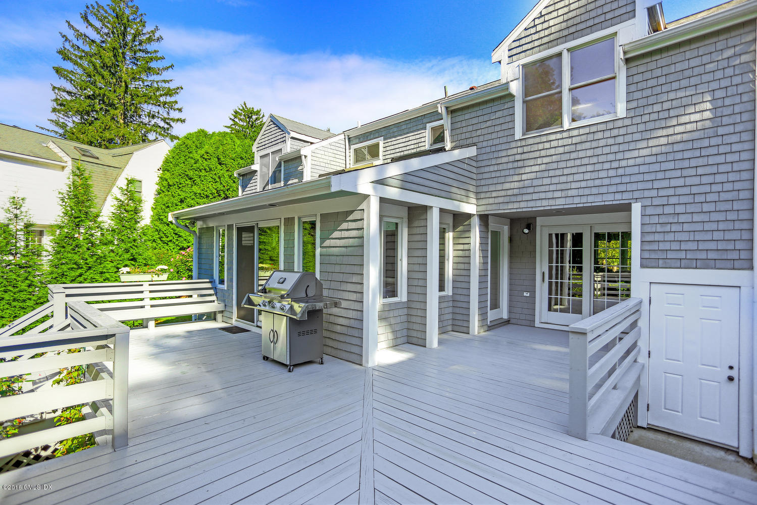 12 Lake Drive, Unit SOUTH Riverside, CT 06878 - Photo 14 of 21 a view of a house with a deck and a garden