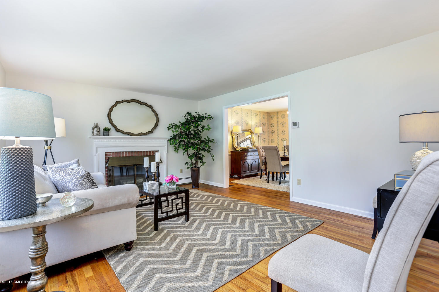 12 Lake Drive, Unit SOUTH Riverside, CT 06878 - Photo 3 of 21 a living room with furniture and a fireplace
