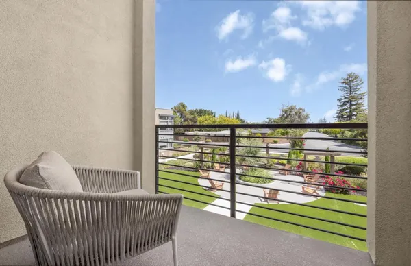 a view of a balcony with a chair