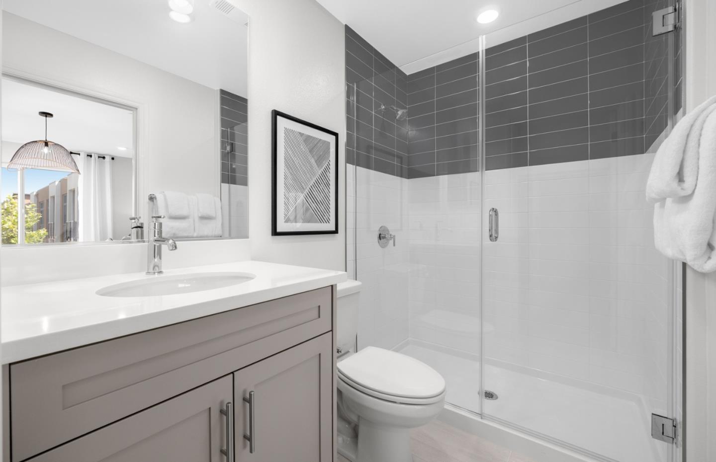 11040 Maple Place, Unit 2806 PLAN 2 Saratoga, CA 95070 - Photo 14 of 21 a bathroom with a sink a toilet and shower