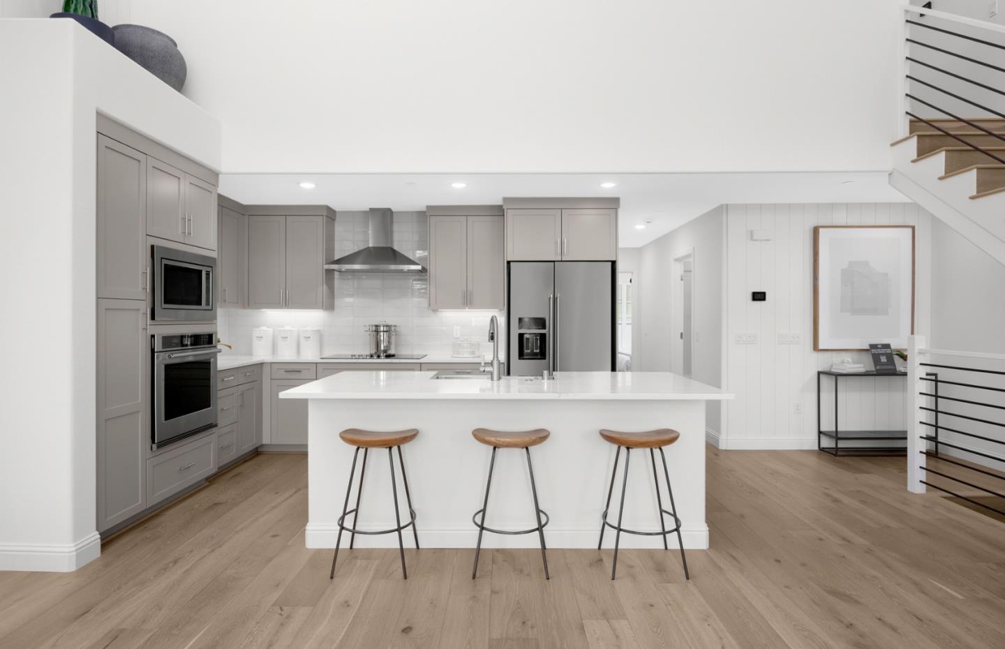 11040 Maple Place, Unit 2806 PLAN 2 Saratoga, CA 95070 - Photo 18 of 21 a kitchen with stainless steel appliances granite countertop a stove a sink dishwasher and a refrigerator with wooden floor
