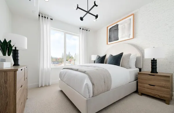 a bedroom with bed and window