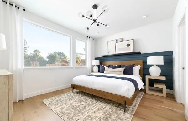 a bedroom with a bed and window