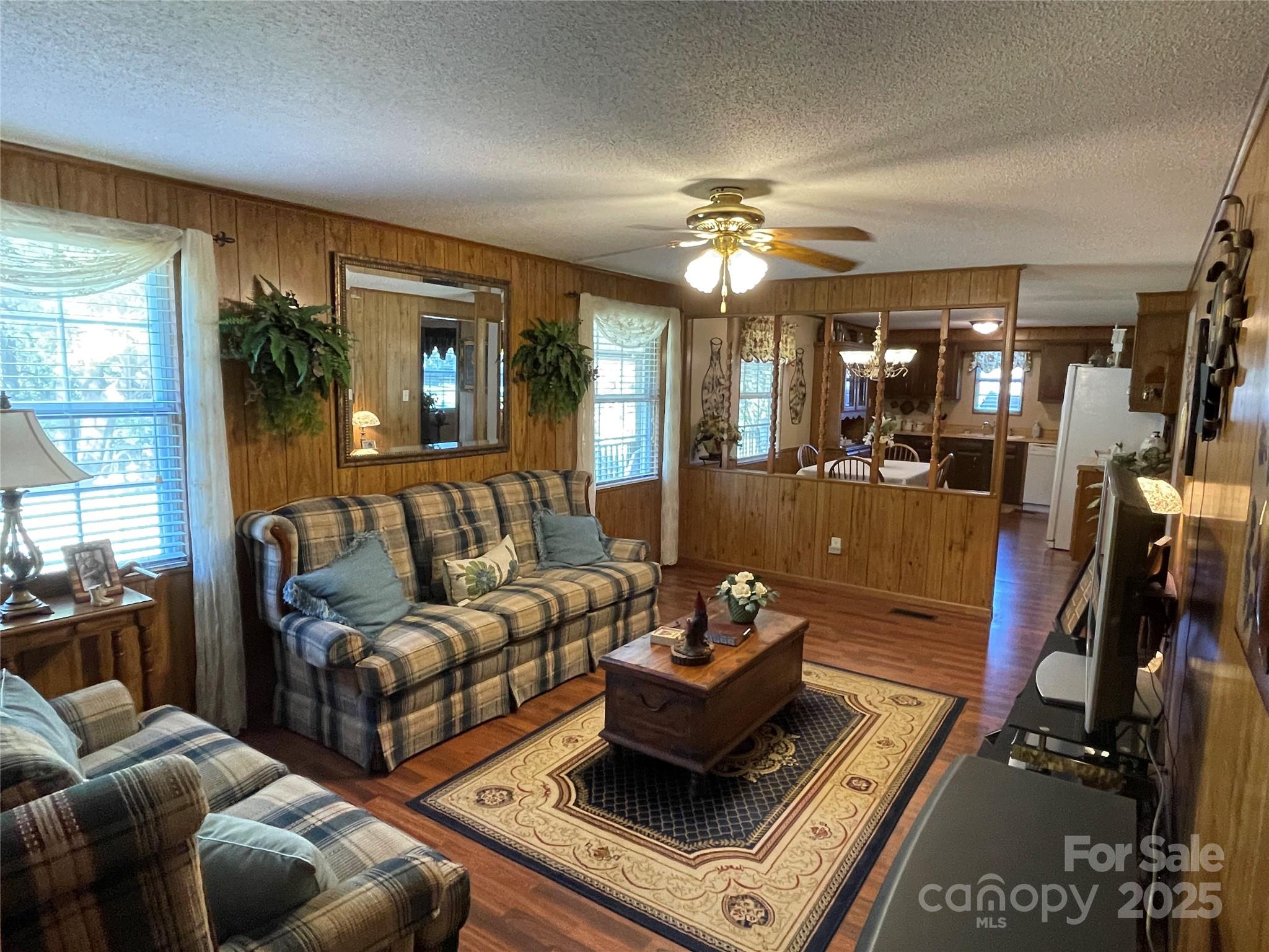 3403 Beaty Road Gastonia, NC 28056 - Photo 18 of 40 a living room with furniture and a chandelier