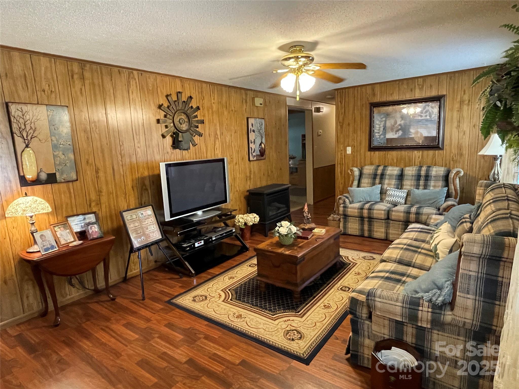 3403 Beaty Road Gastonia, NC 28056 - Photo 19 of 40 a living room with furniture and a flat screen tv