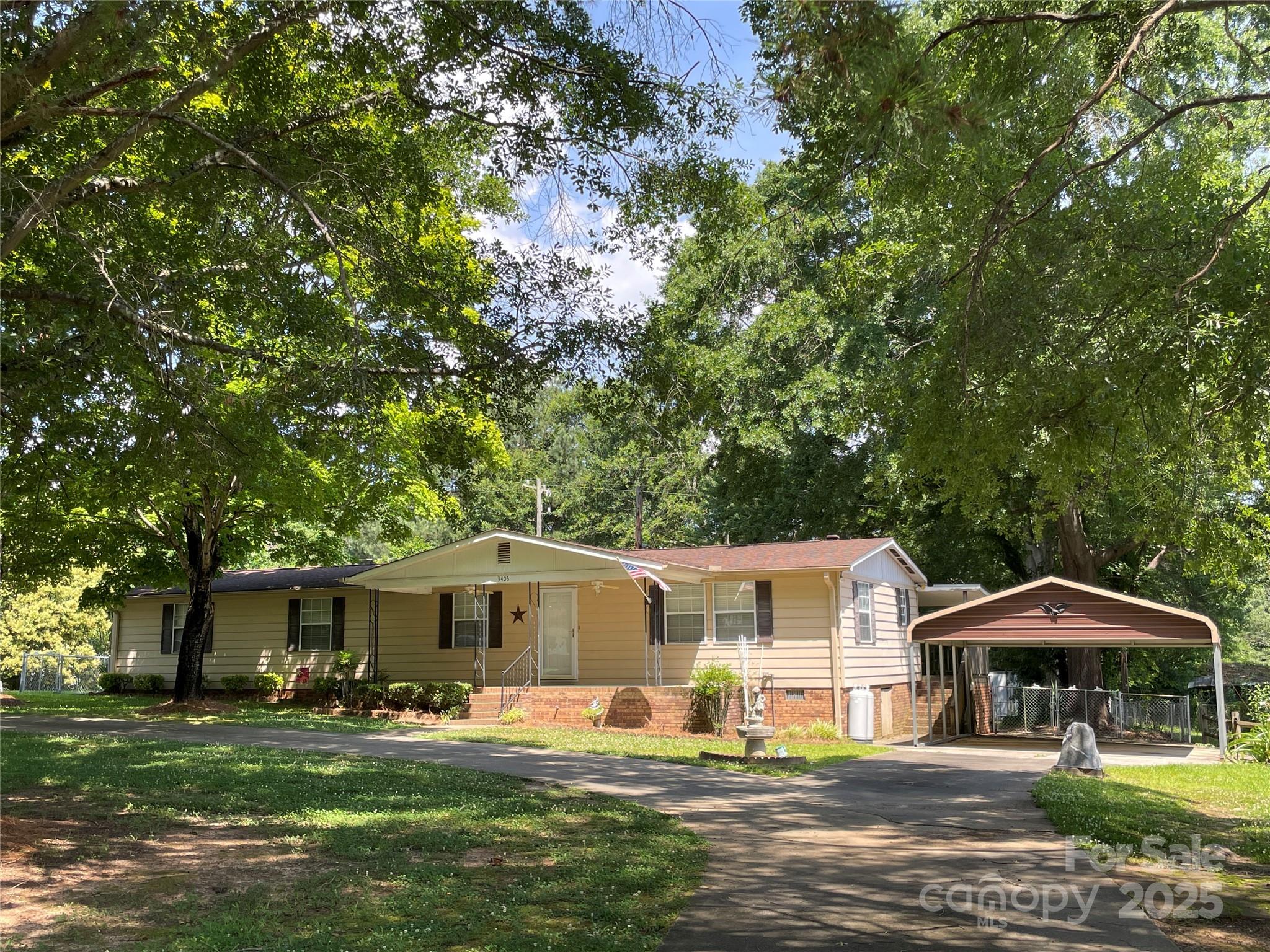 3403 Beaty Road Gastonia, NC 28056 - Photo 2 of 40 a front view of a house with garden