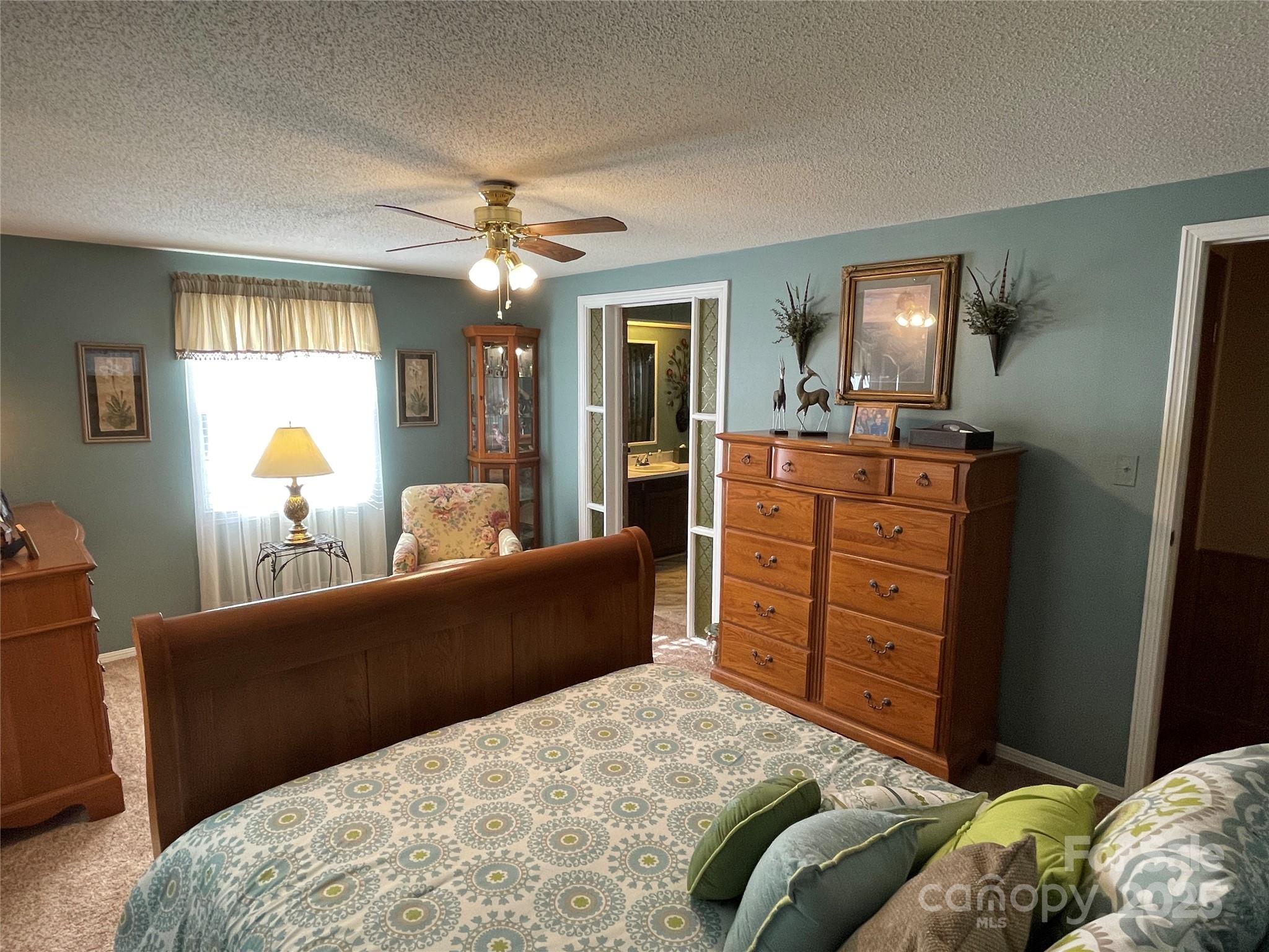3403 Beaty Road Gastonia, NC 28056 - Photo 21 of 40 a bedroom with a bed and wooden floor