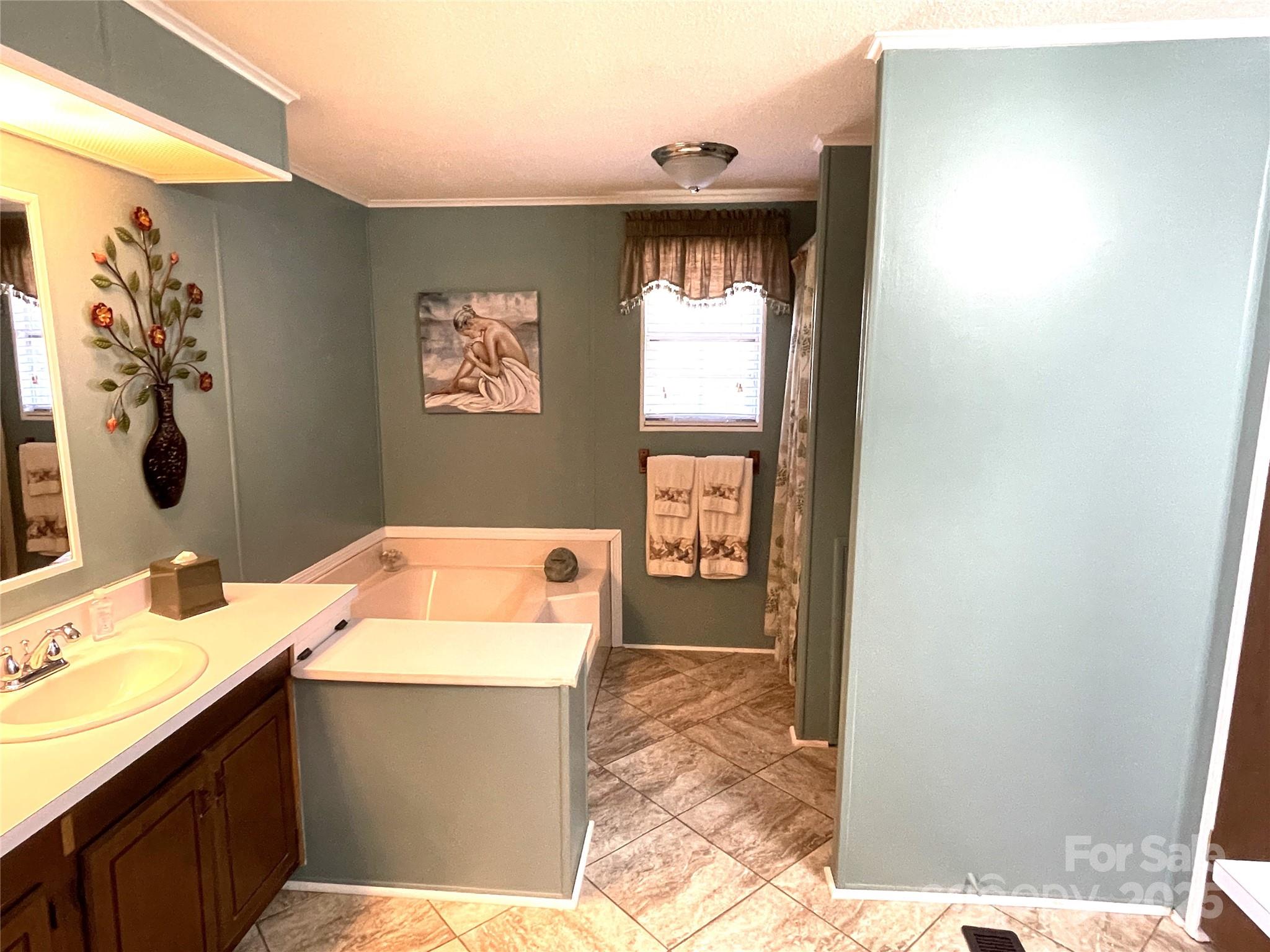 3403 Beaty Road Gastonia, NC 28056 - Photo 23 of 40 a bathroom with a sink and a mirror