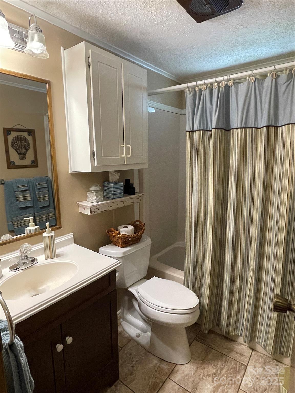 3403 Beaty Road Gastonia, NC 28056 - Photo 29 of 40 a bathroom with a sink a toilet and shower