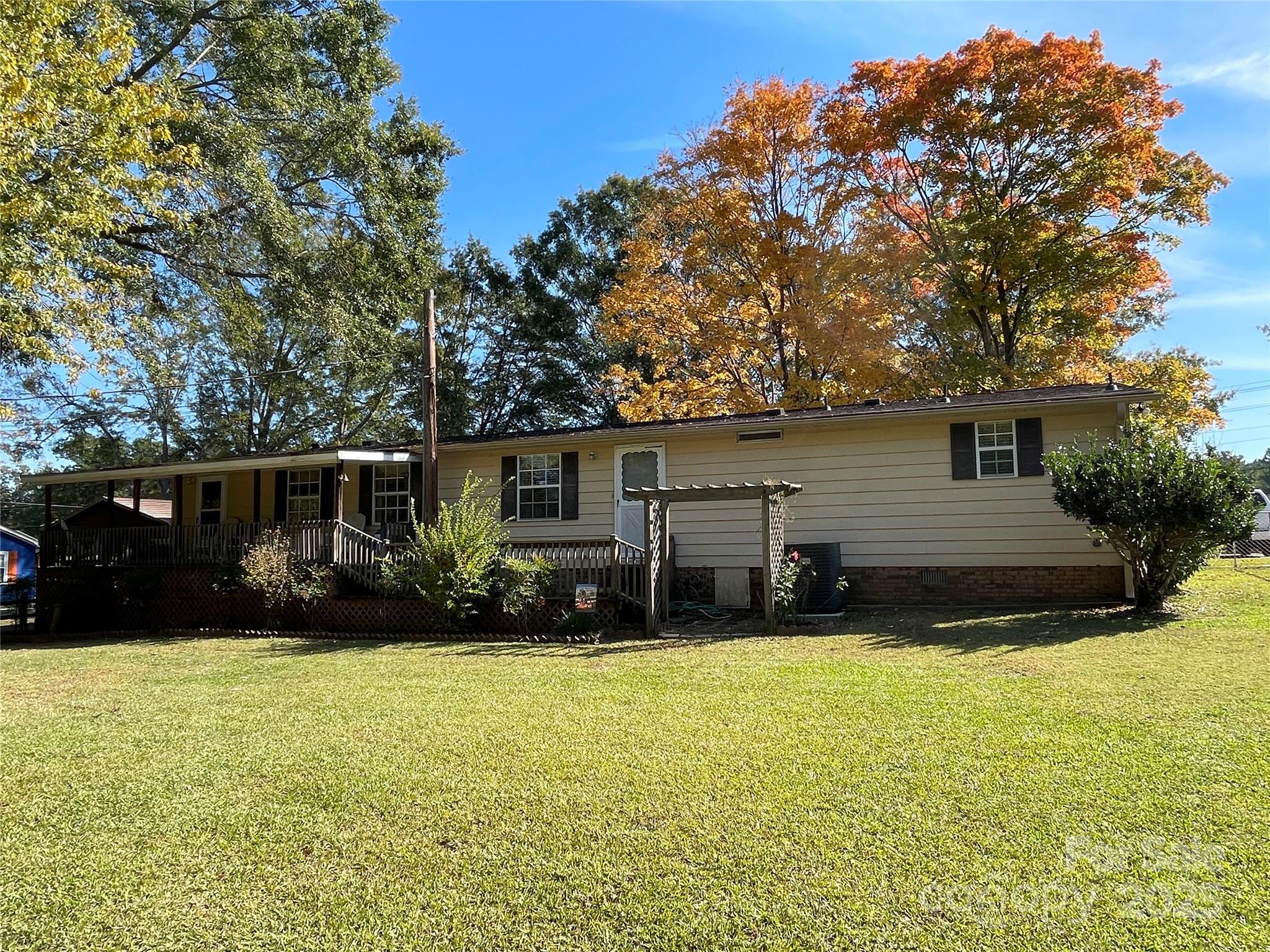 3403 Beaty Road Gastonia, NC 28056 - Photo 7 of 40 a view of a house with a yard