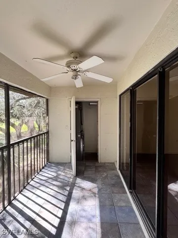 a view of a hallway with a chandelier