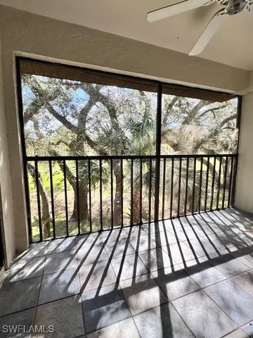 a view of a balcony with wooden floor