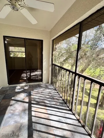 a view of balcony with wooden floor