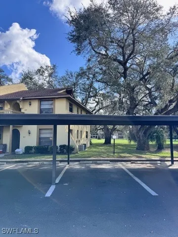 a house view with a big yard
