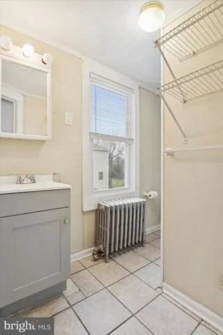 a bathroom with a sink a mirror and a bathtub