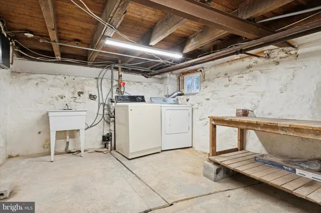 a utility room with dryer and washer