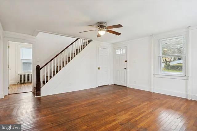 a view of an entryway with wooden floor