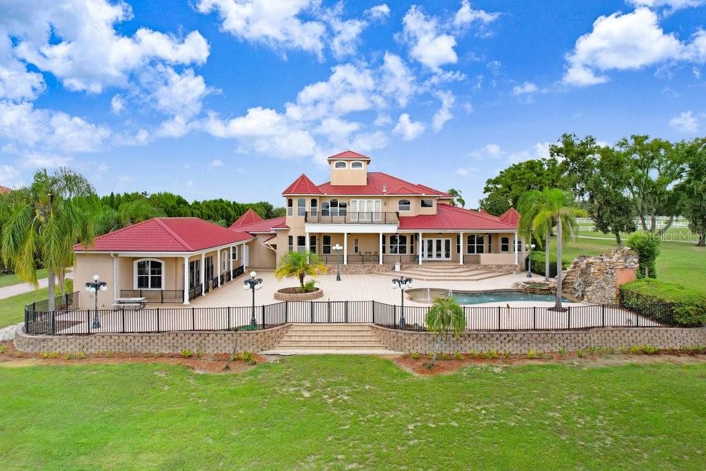 11715 Taylor Road Thonotosassa, FL 33592 - Photo 2 of 73 a view of a house with a yard porch and sitting area