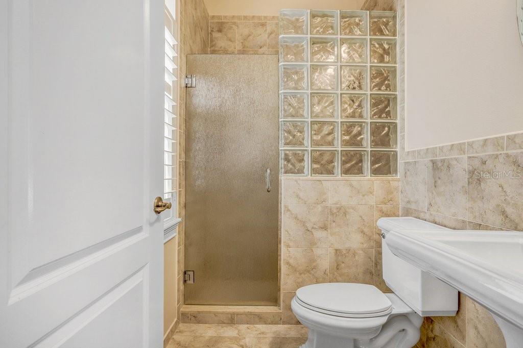 11715 Taylor Road Thonotosassa, FL 33592 - Photo 54 of 73 a bathroom with a toilet and a shower