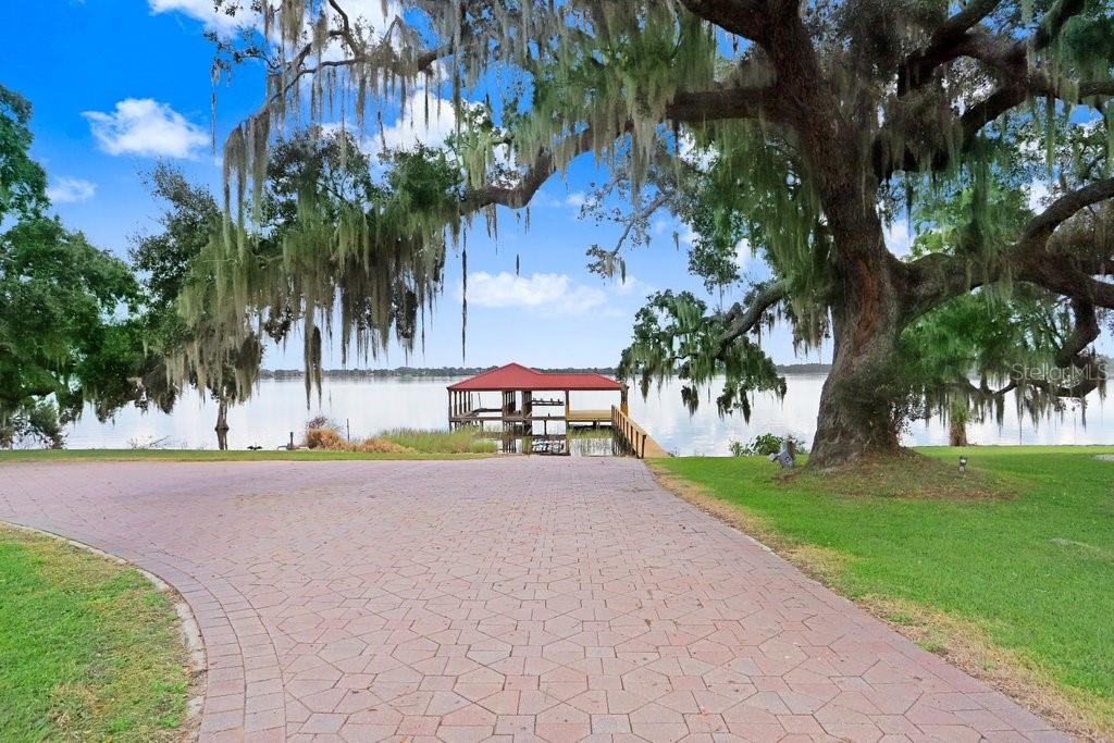 11715 Taylor Road Thonotosassa, FL 33592 - Photo 62 of 73 a front view of a house with a yard and a garage