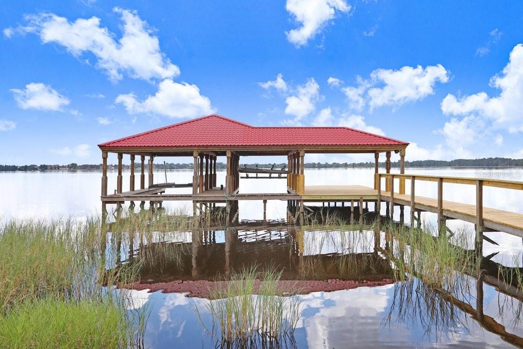 11715 Taylor Road Thonotosassa, FL 33592 - Photo 63 of 73 a view of a lake with a mountain view in the background
