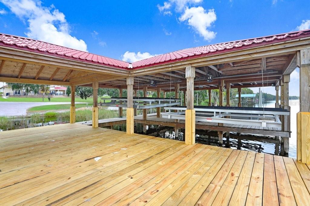 11715 Taylor Road Thonotosassa, FL 33592 - Photo 65 of 73 a view of a patio with a table and chairs in a patio